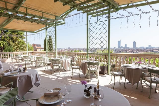 Elegant outdoor dining terrace at Villa Florentine, perfect for upscale events and meetings.