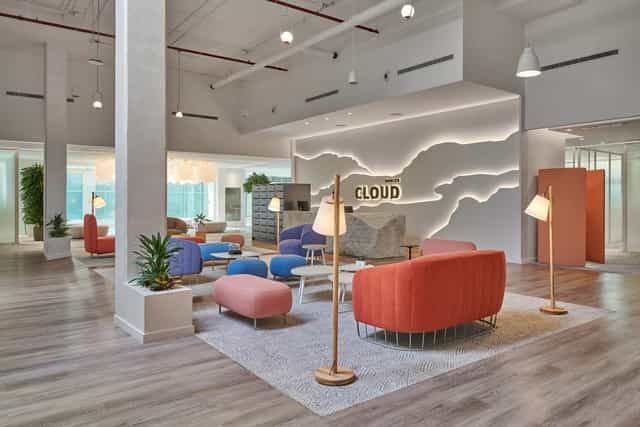 Modern co-working space with vibrant decor for workshops and brainstorming sessions.