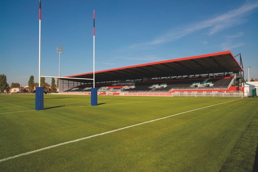 Rugby field at Matmut Stadium with goalposts; ideal venue for outdoor events and team-building.