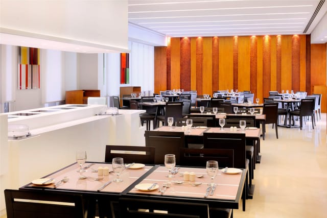 Modern restaurant at HUES Boutique Hotel, ideal for events and meetings with ample natural light.