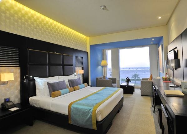 Meeting room in HUES Boutique Hotel with king-sized bed, ideal for events and meetings.