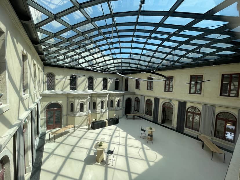 Conference room with glass roof at Carré Fourvière; ideal for corporate events and workshops.