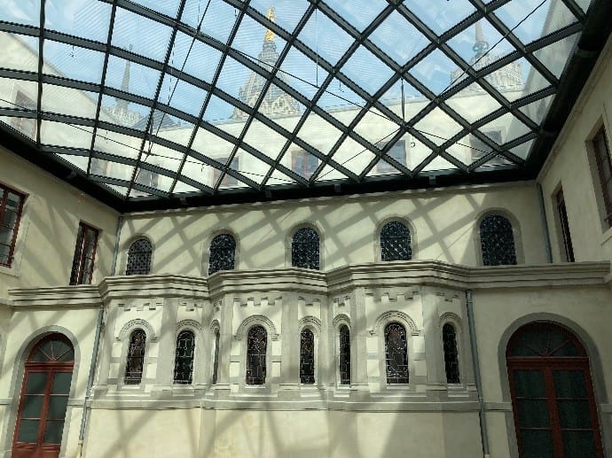 La Cour Carrée atrium with glass roof, perfect for elegant events and gatherings.