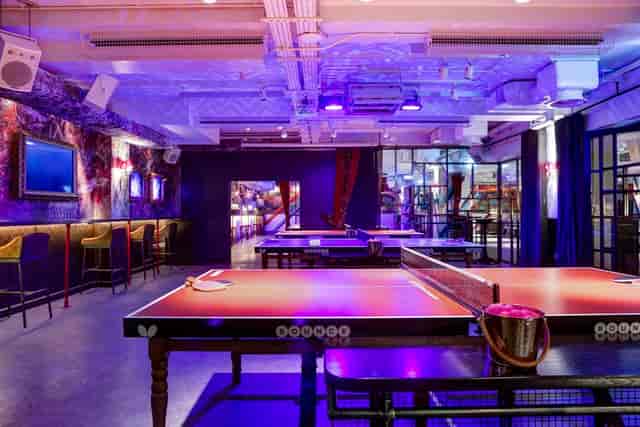 Vibrant event space with ping pong tables for social gatherings in Shoreditch.