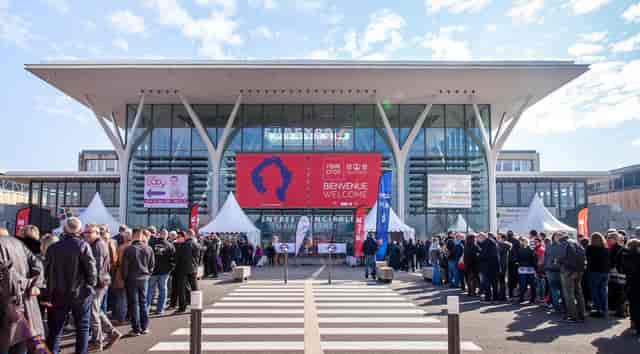 Eurexpo Lyon entrance with welcome banner for a busy trade show event.