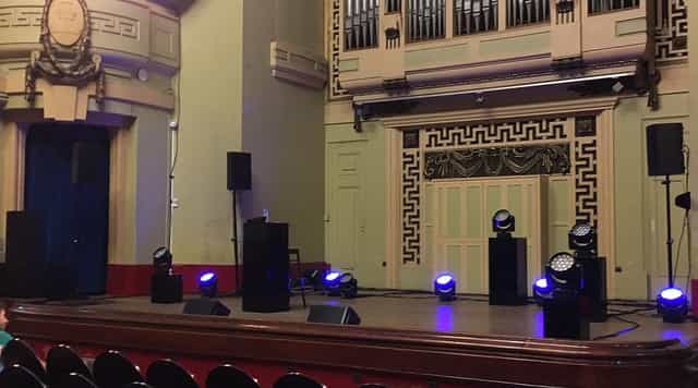 Salle Molière stage with lighting, perfect for engaging meetings and live events.