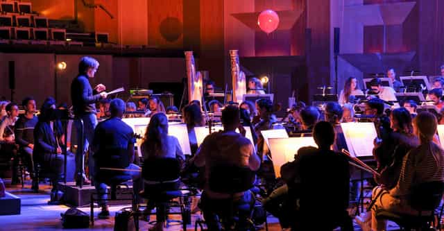 Orchestral rehearsal at Espace découverte, Auditorium de Lyon, showcasing vibrant ambiance.