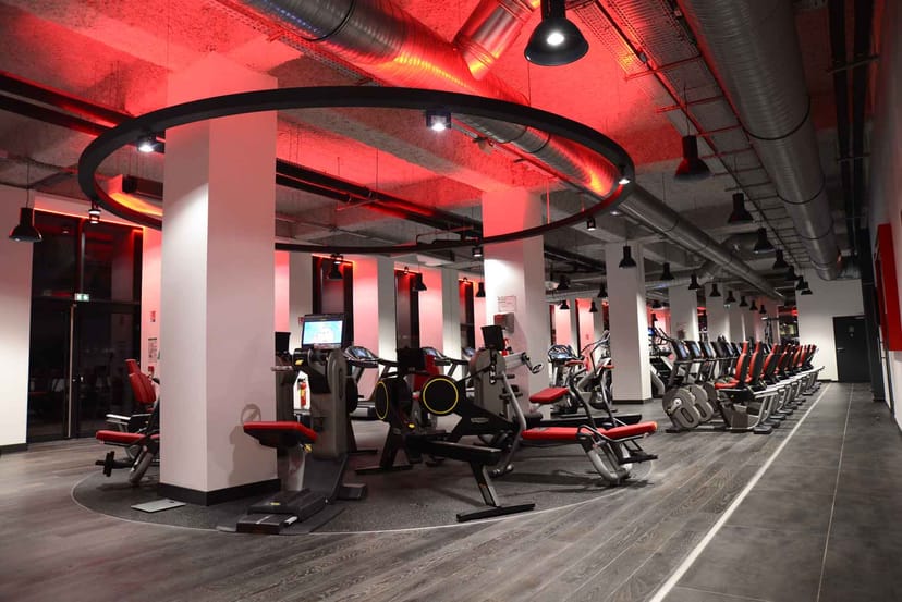 Modern wellness center gym with sleek equipment; perfect for fitness retreats and corporate events.