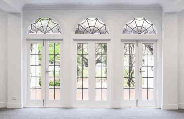 Elegant doors framed by large windows at Ian Potter House Ballroom for events.