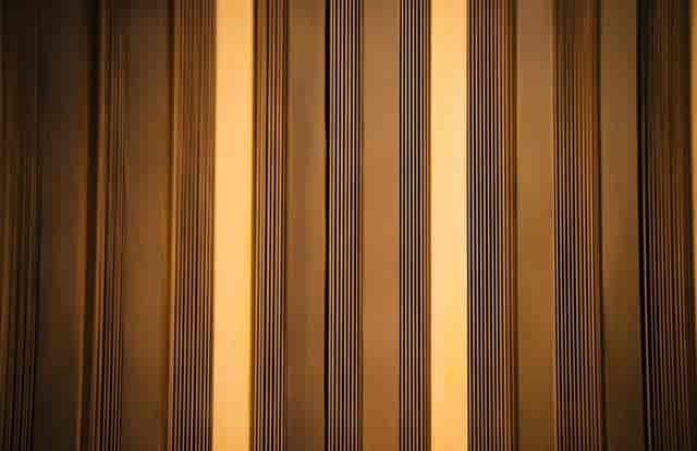 Ian Wark Theatre with warm striped backdrop, ideal for corporate events and conferences.