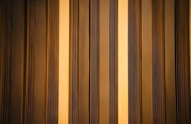 Ian Wark Theatre with warm striped backdrop, ideal for corporate events and conferences.