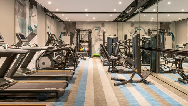 Modern fitness center at Tactic 5, Aloft Dubai Creek - ideal for wellness events and networking.