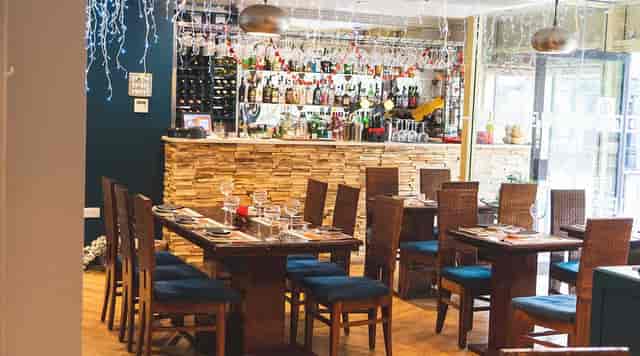 Elegant dining area in Arnero Indian Restaurant, perfect for intimate events and gatherings.