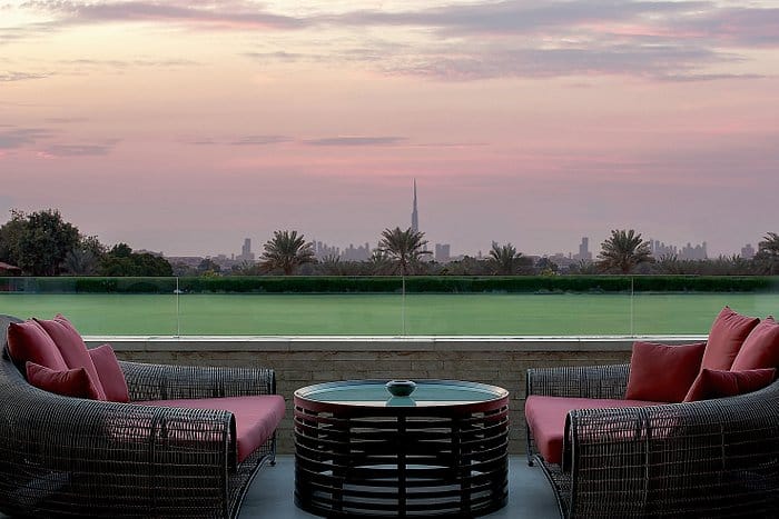 Stylish outdoor seating with skyline view, ideal for networking events and cocktail receptions.