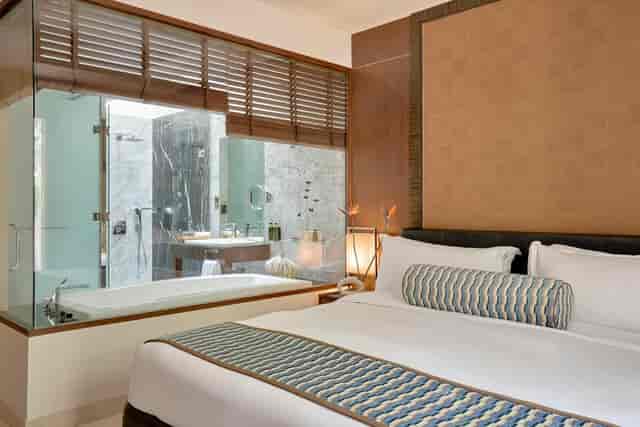 Luxury hotel room with modern design, ideal for business retreats and conferences.