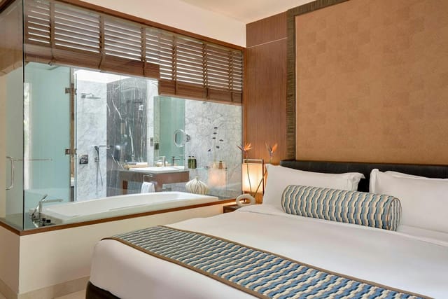 Luxury hotel room with modern design, ideal for business retreats and conferences.