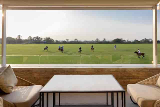 Elegant outdoor venue at Meliá Desert Palm with polo field view for upscale events.