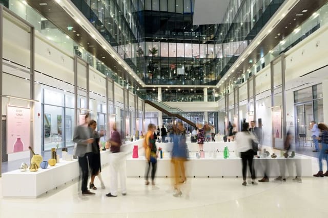 Atriums in Dubai Design District, modern event space with art installation for exhibitions.