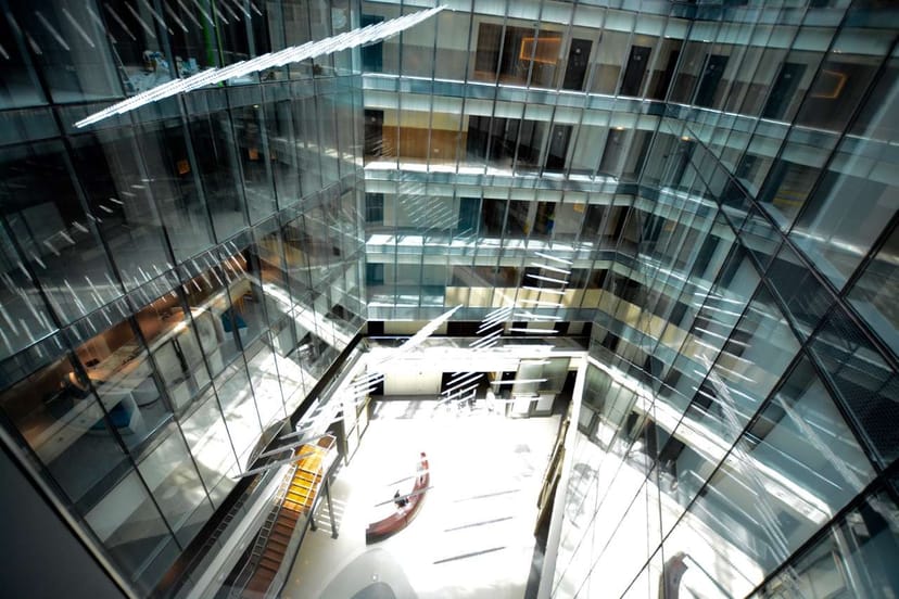 Modern glass atrium in Dubai Design District, perfect for corporate networking events.