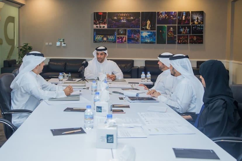 Conference Room at Al Majaz Amphitheatre with diverse professionals collaborating for events.