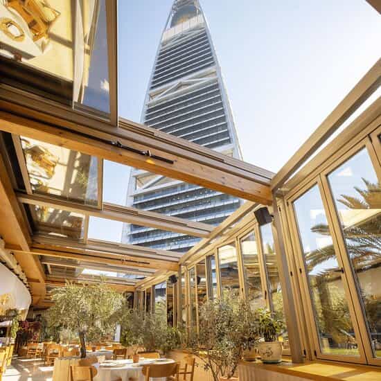 Modern Meraki Restaurant with glass panels, perfect for upscale corporate events.