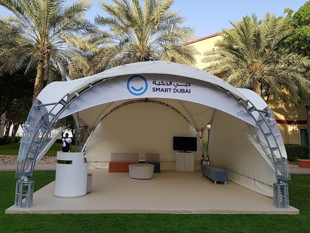 "Smart Dubai outdoor event tent with sleek design for networking in a tech gathering."