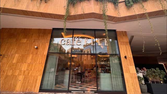 Stylish glass entrance of Café ELLE, perfect for networking and casual meetings in VIA Riyadh