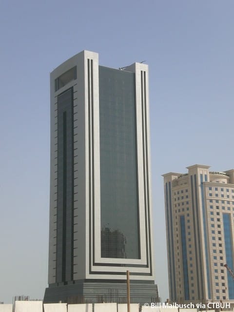 Sleek glass skyscraper in Alsahab Building for corporate events and meetings.