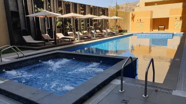 Luxurious outdoor pool at Citadines Abha ideal for social events and gatherings.