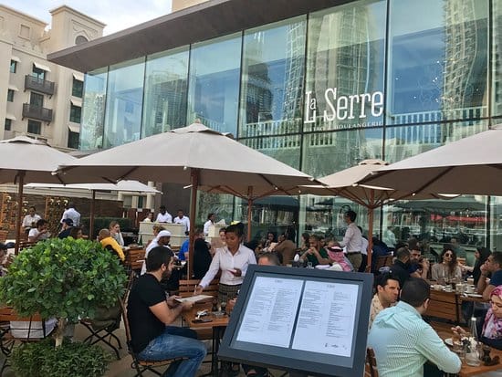 Vibrant outdoor dining area at La Serre, perfect for business meetings and networking events.