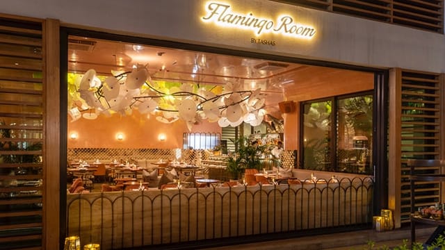 Elegant Flamingo Room by tashas with warm lighting for upscale events and gatherings.