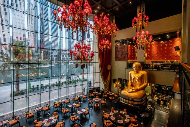 Buddha-Bar Dubai venue with floor-to-ceiling windows, perfect for upscale events and receptions.