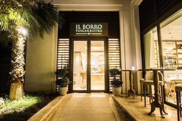 Modern bistro entrance with outdoor seating for upscale events in Il Borro Tuscan Bistro.
