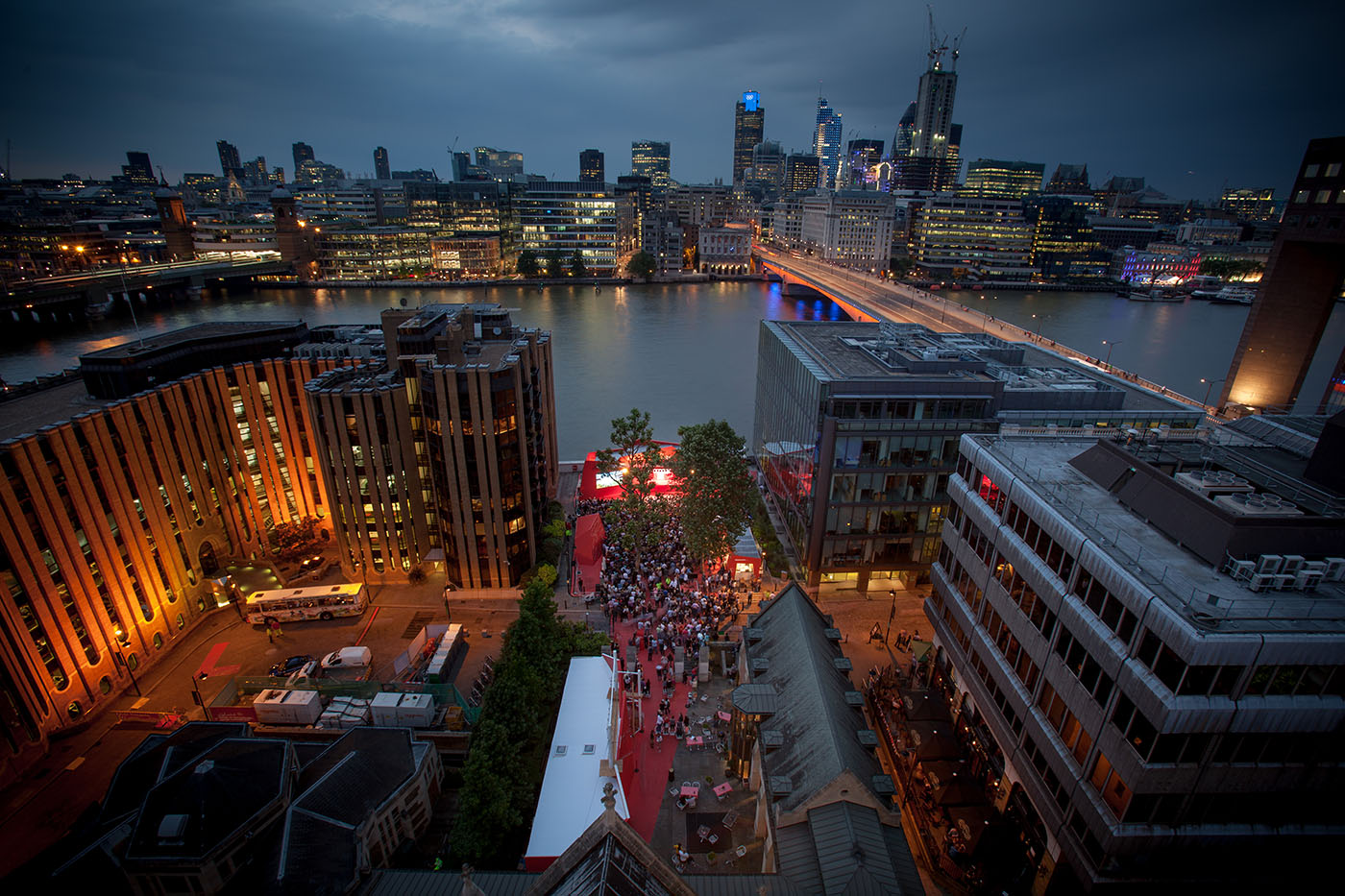 Millennium Courtyard at Southwark Cathedral, vibrant networking event with red carpet. - Banner