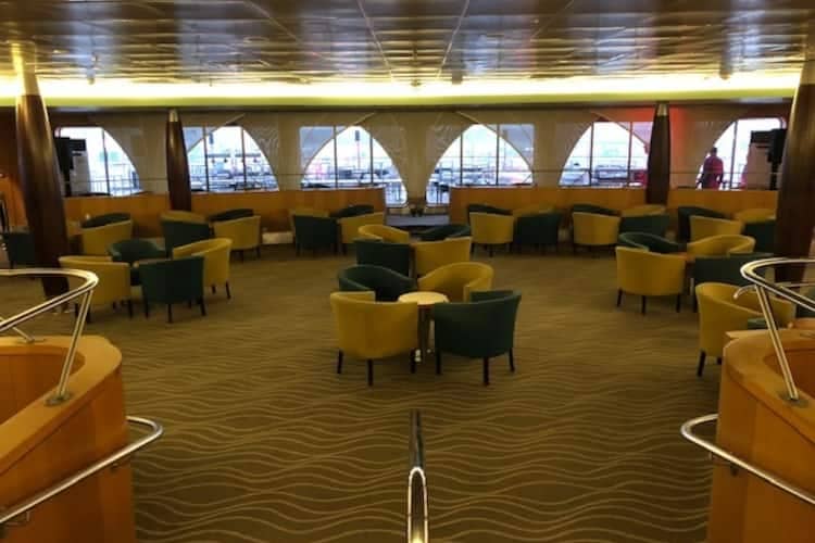 Spacious Yacht Club deck with modern lounge chairs for casual networking events