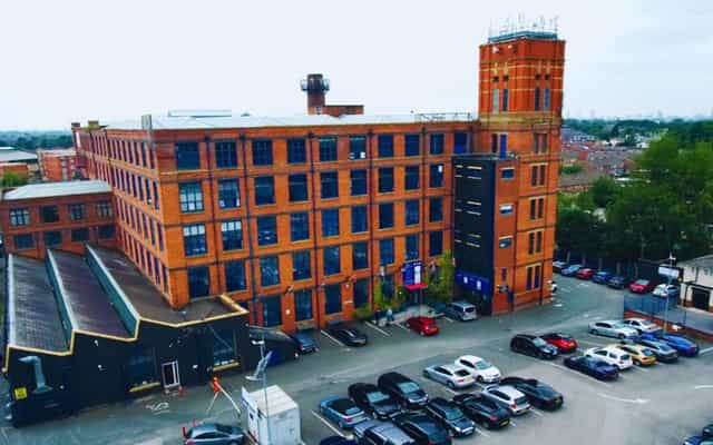 Historic Ivy Business Centre conference room with brick architecture for corporate events.