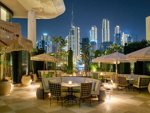 Sophisticated outdoor restaurant venue with stylish seating, ideal for evening events.
