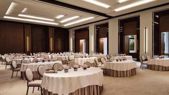 Sophisticated event space with elegant tables, ideal for conferences and corporate meetings.