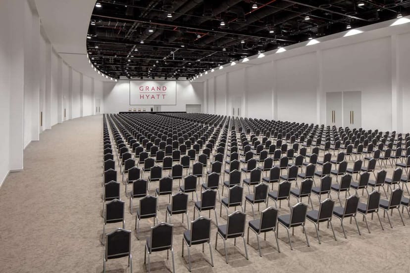South Halls conference hall in Dubai Expo City, featuring rows of black chairs for events.