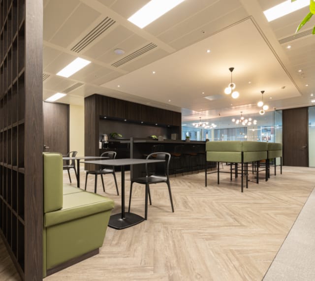 Modern office meeting space in Gilbanks Manchester with sleek furnishings, ideal for networking events.