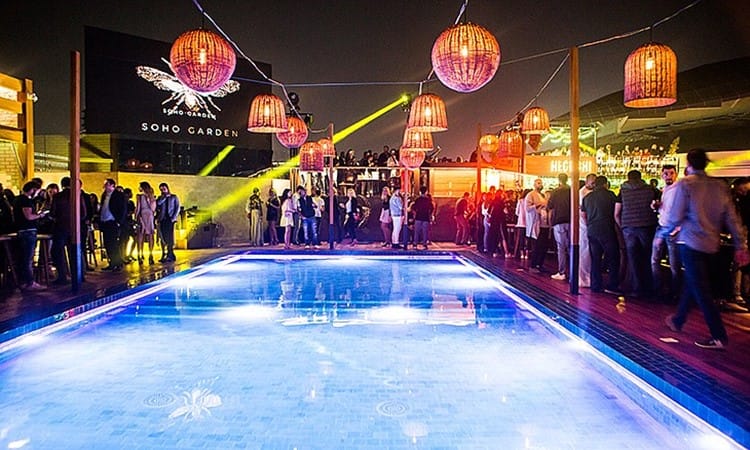 Soho Garden rooftop nightclub with illuminated pool, vibrant for social events and parties.