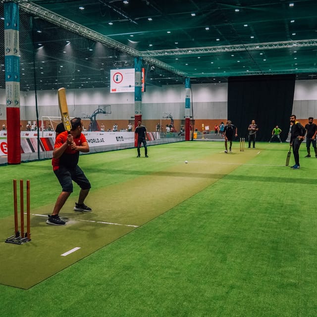 Cricket field in Dubai Sports World, featuring artificial grass for corporate events.