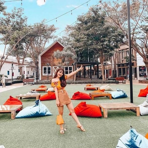 Vibrant outdoor event space with colorful bean bags for casual gatherings and networking.