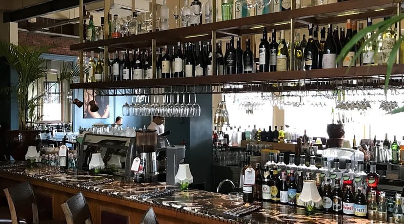 Elegant bar area with extensive wine selection, perfect for cocktail receptions and networking.