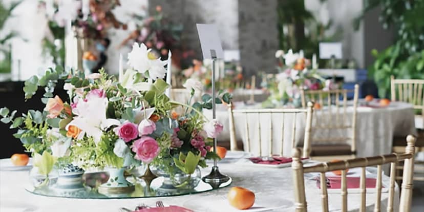 Elegant dining setup at K22 Bar Terrace with vibrant flowers, perfect for weddings and corporate events.