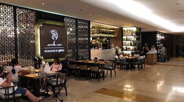 Stylish seafood restaurant dining area with warm lighting for gatherings and meetings.