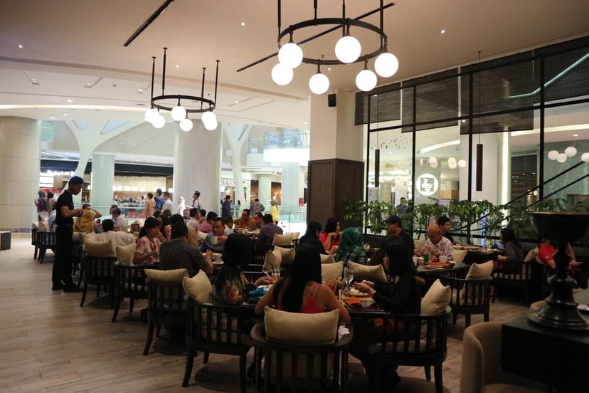 Dining area at Seribu Rasa, stylish decor ideal for networking events and gatherings.