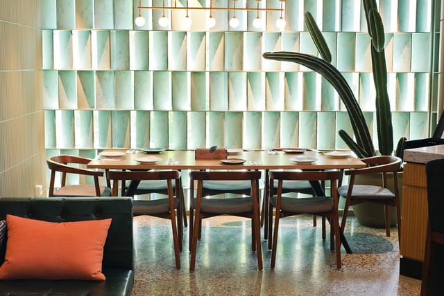 Stylish VIP Room with round table, modern chairs, ideal for meetings and gatherings.