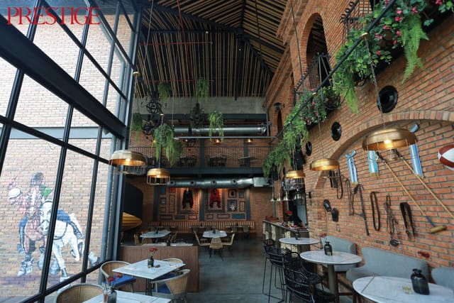 Stylish indoor venue with exposed brick, perfect for corporate events and gatherings.