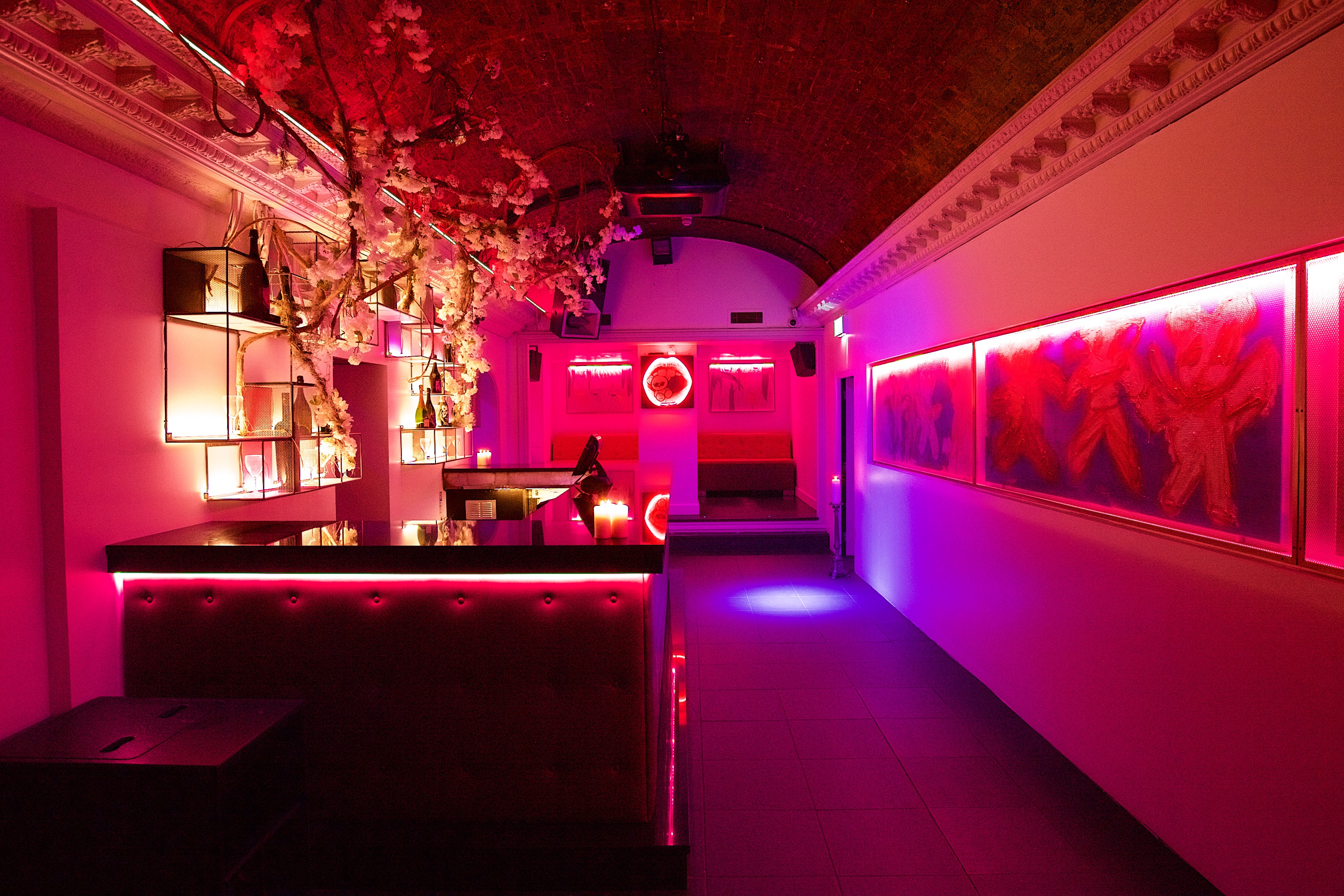 Stylish event space in Toy Room with pink lighting for cocktail receptions and gatherings. - Banner